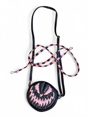 Round Black Crossbody Bag with Pink Graphic Accent